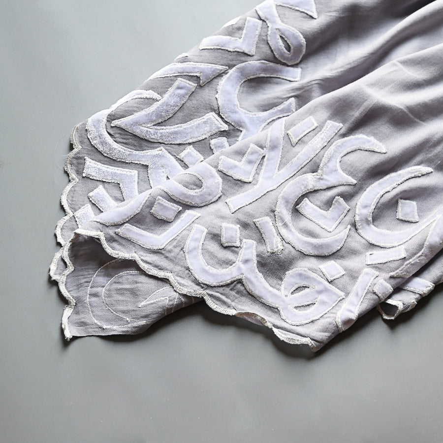 
                  
                    Ash & White Velvet Applique Work Calligraphy Scarf
                  
                